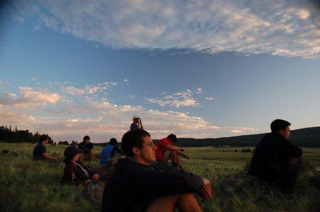 The crew watching the sunset at Apache Springs, Philmont