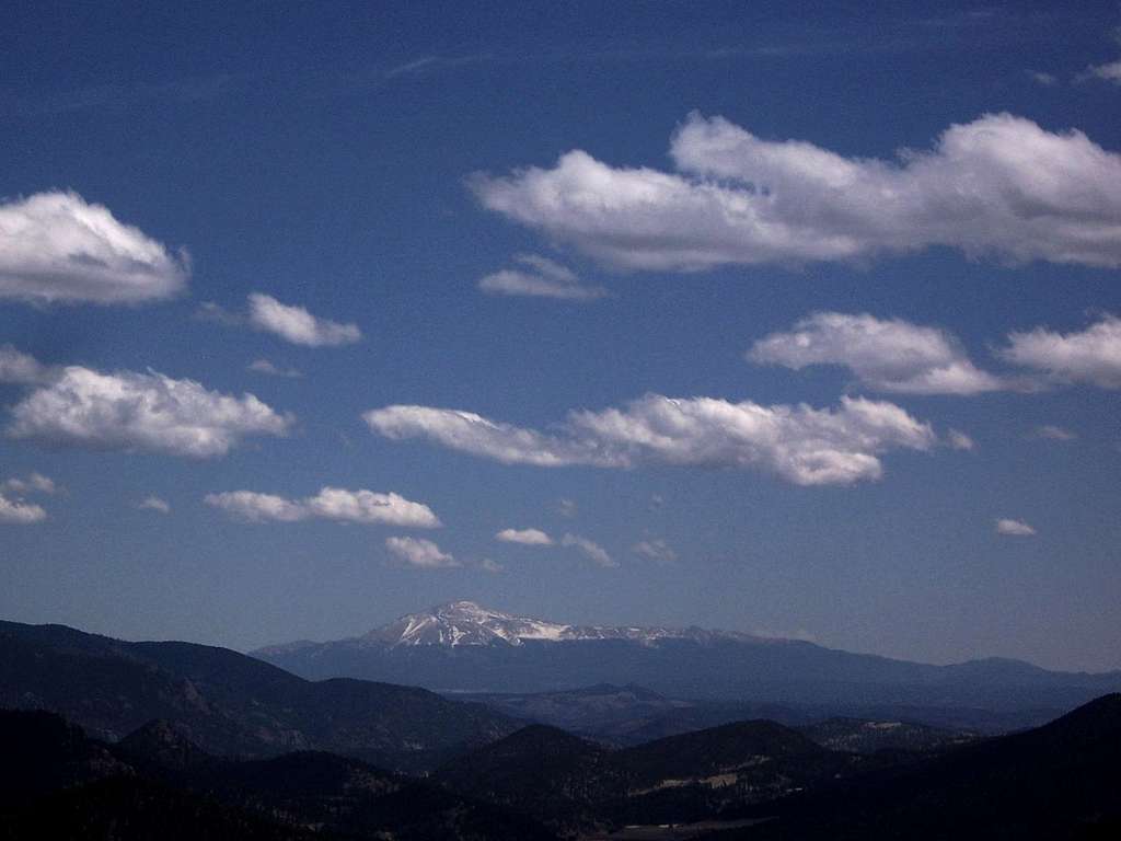 Pikes Peak stands alone to the southeast
