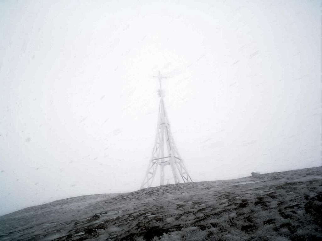 Summit's cross in the fog