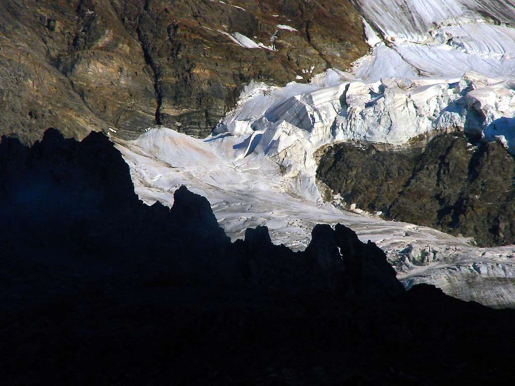 The wild seracs of the Rottal glacier in contrast to the rocks of Schwarzmönch in front of them