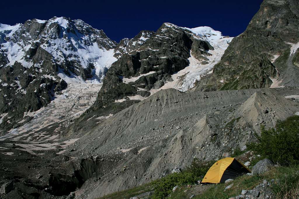 Bivouac Aristova located above the West side of the Shkhelda glacier