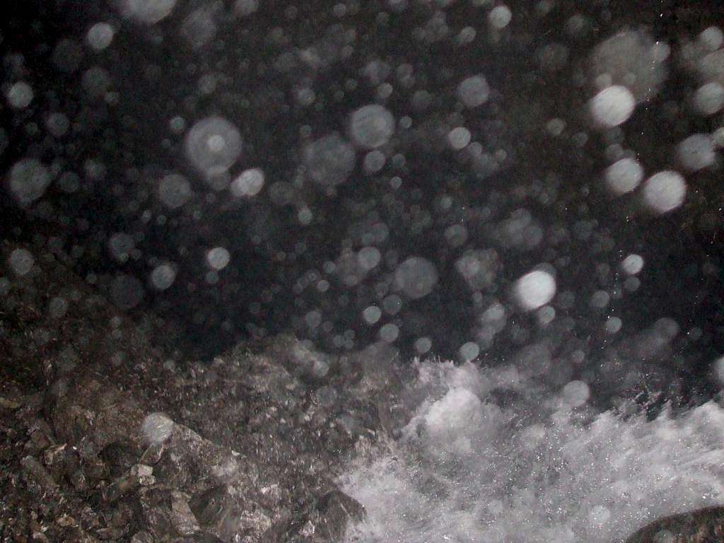 Water tumbling into the abyss of the Moon River Cave