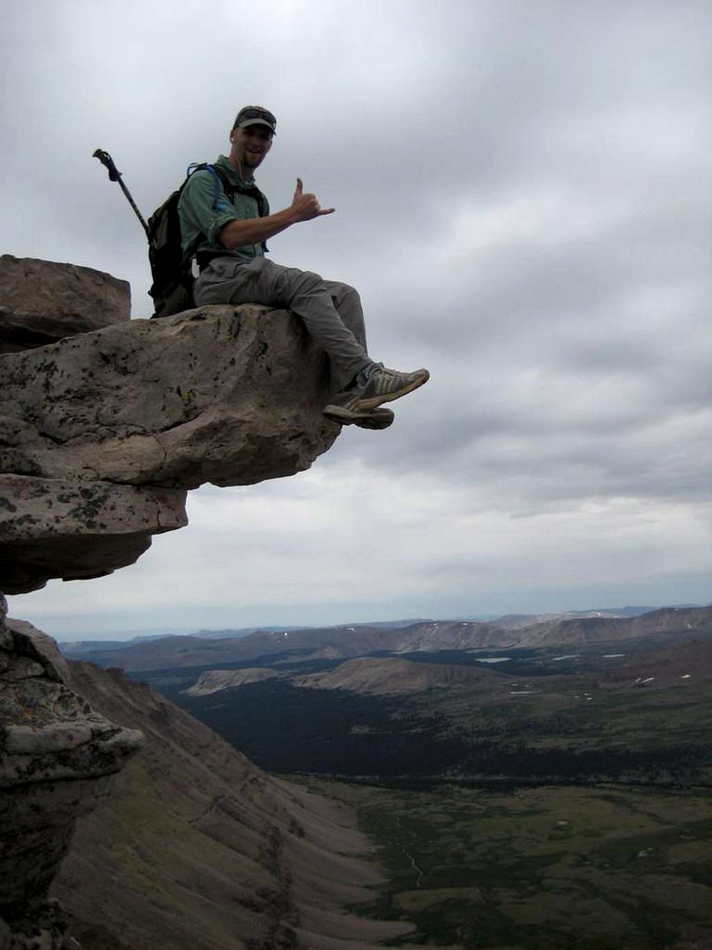 Craig on an exposed boulder below the summit