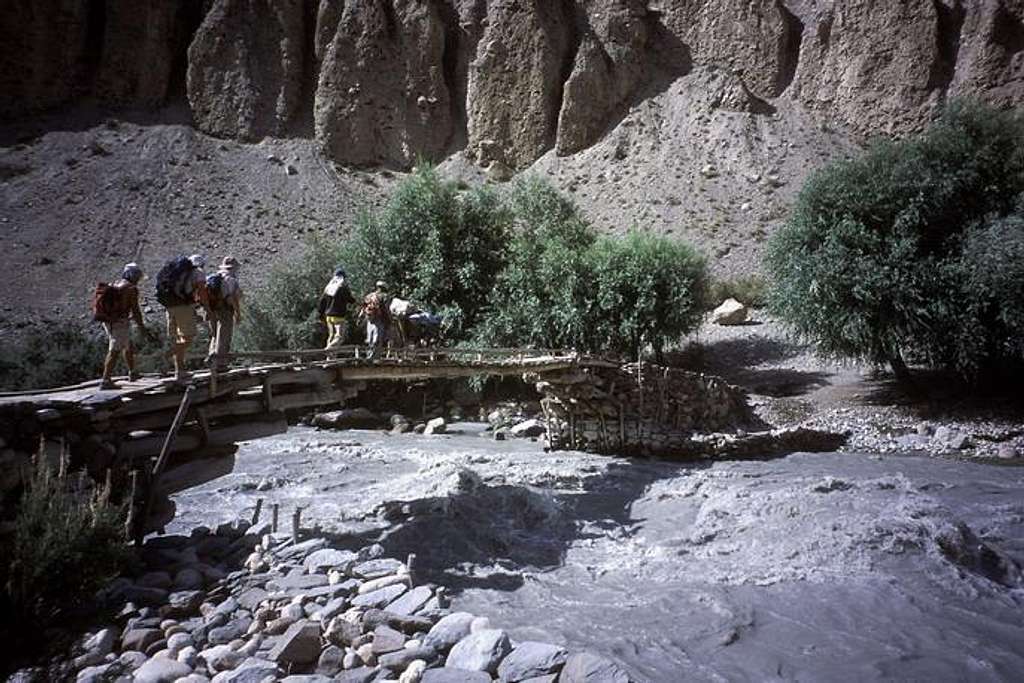 The narrow bridge crossing the big stream of the Tirich valley