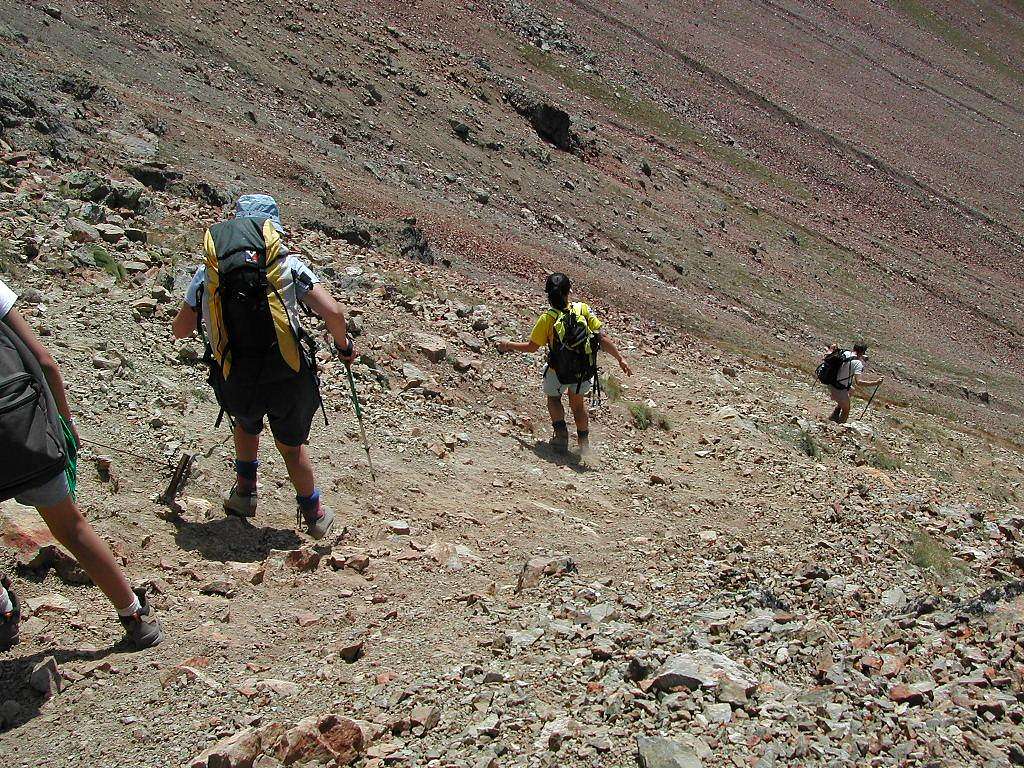 SummitPost members beginning the steep descent from Col Carrel <i>2852 m</i>