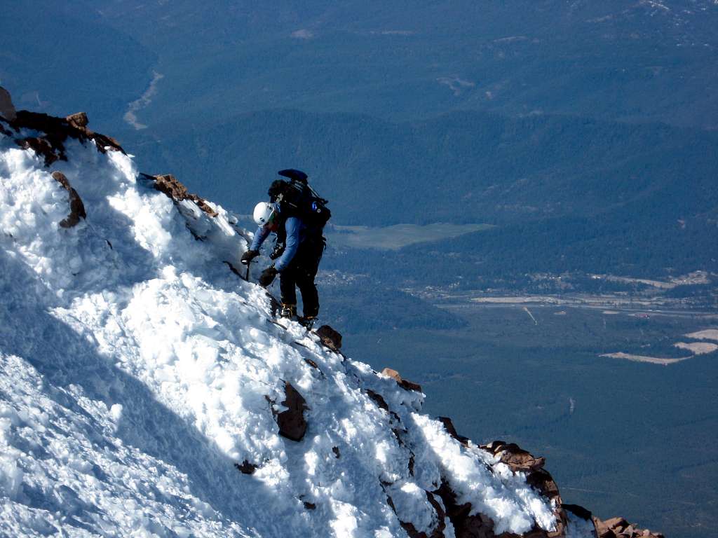 Sonya traversing off of the top of Casaval Ridge