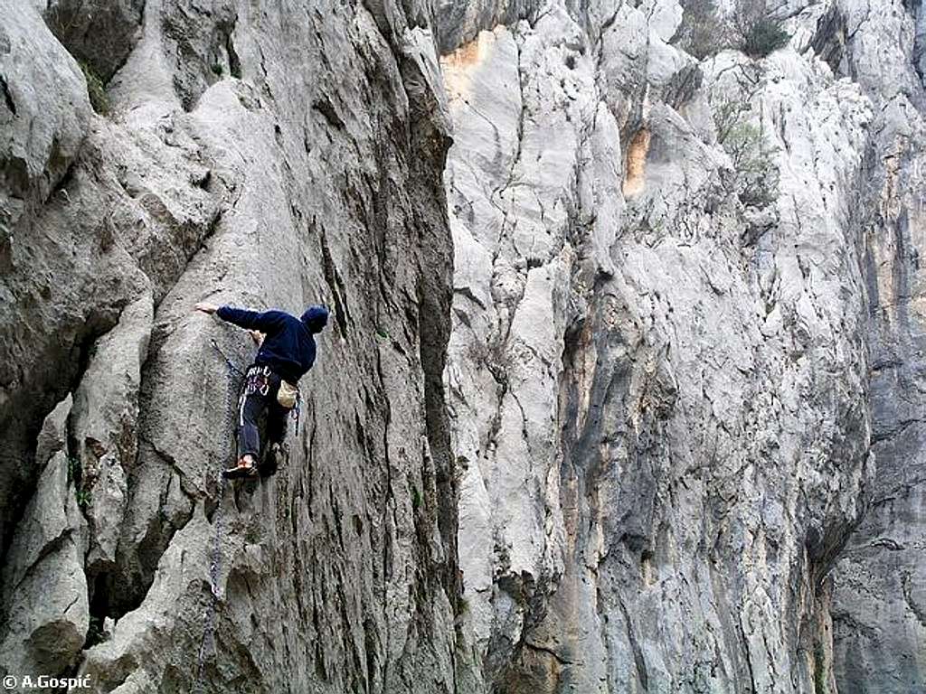 Climber in the cliffs of...