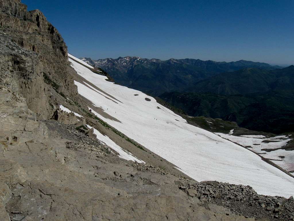 Hikers ascending the last snowfield