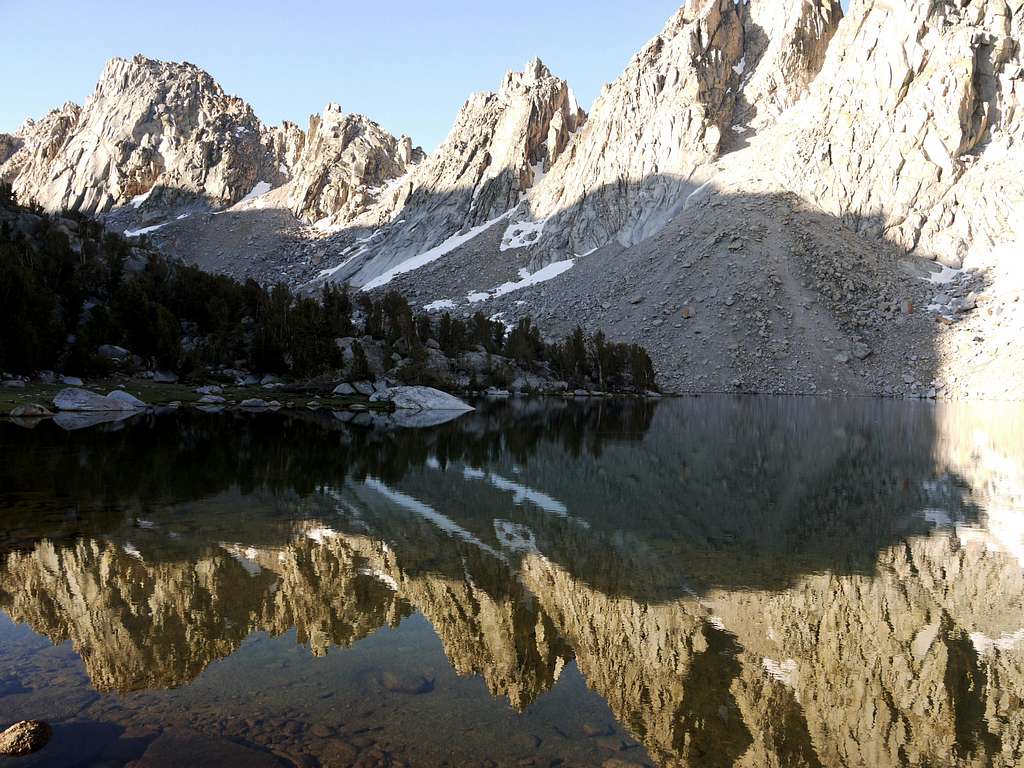 reflection of some mountains in some water