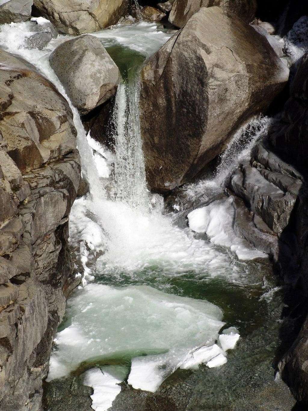 Icy Yosimite Falls away from a trail