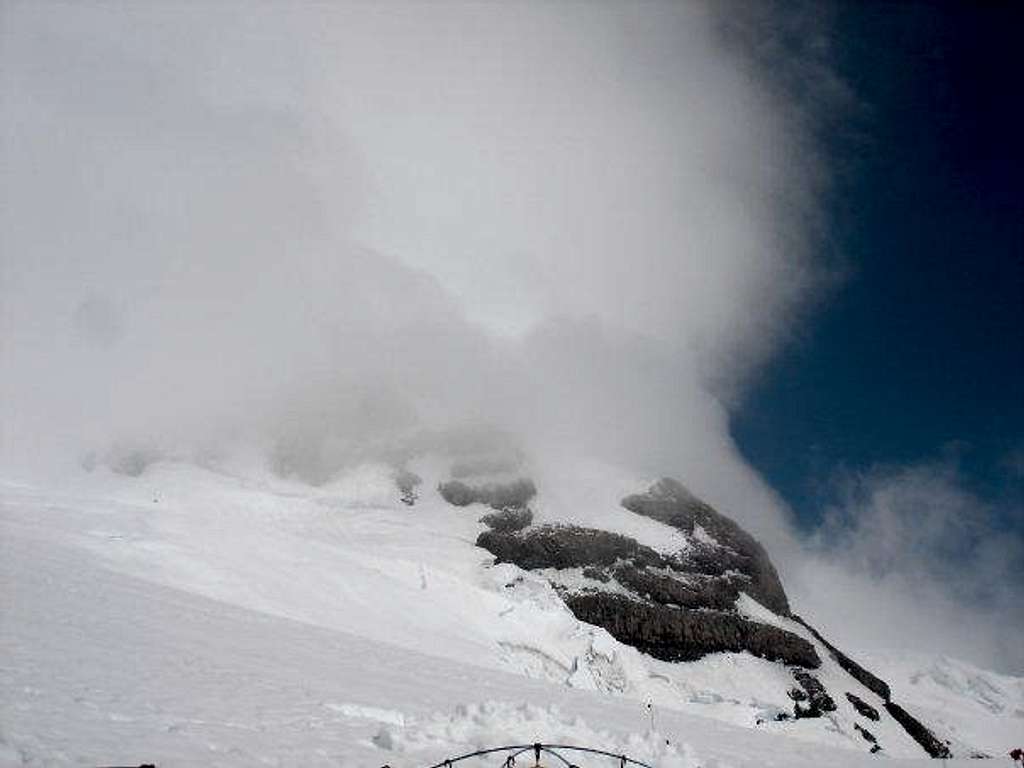 Clouds whipping around.