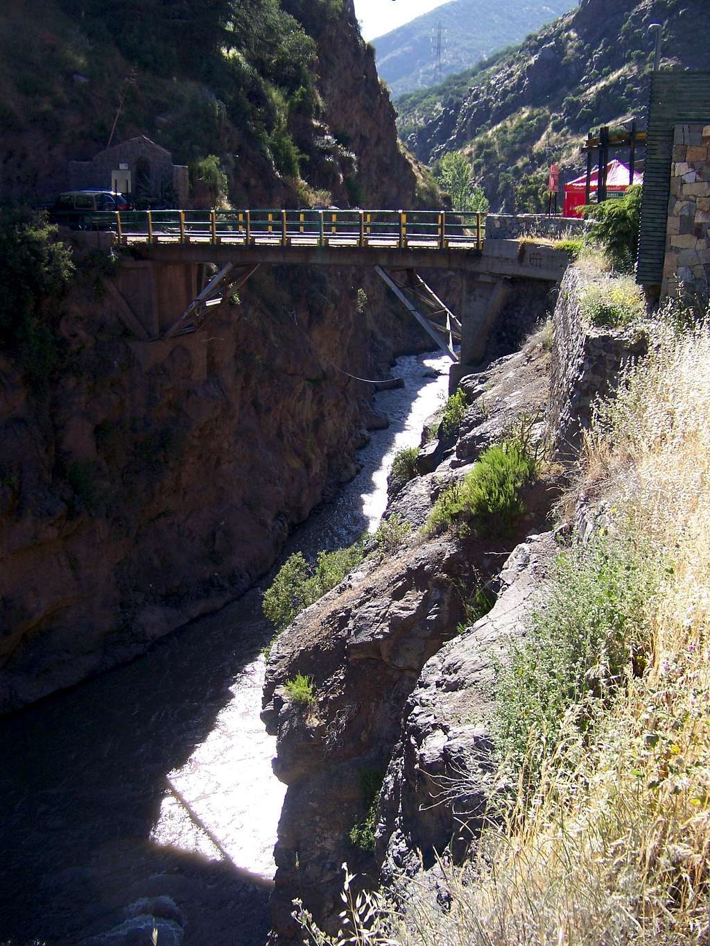 The old wooden bridge above the gorge of Mapocho river