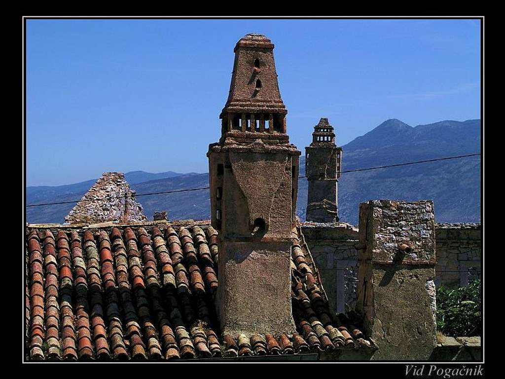 Old chimneys on the roofs of...