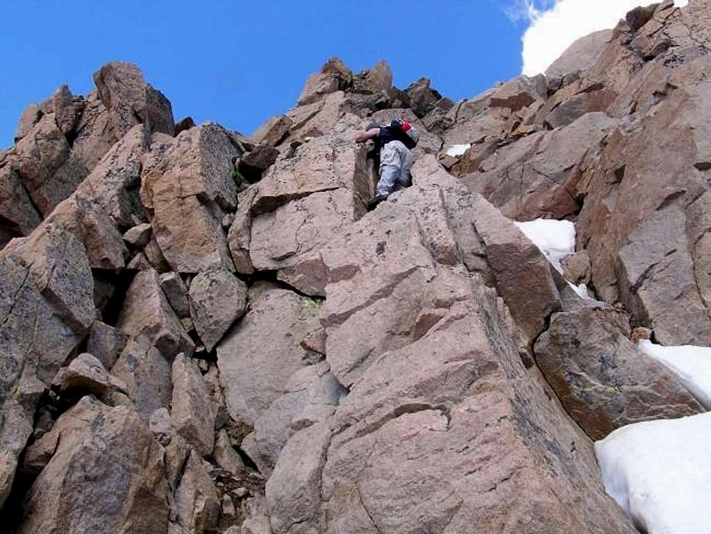 Brandon downclimbing summit...