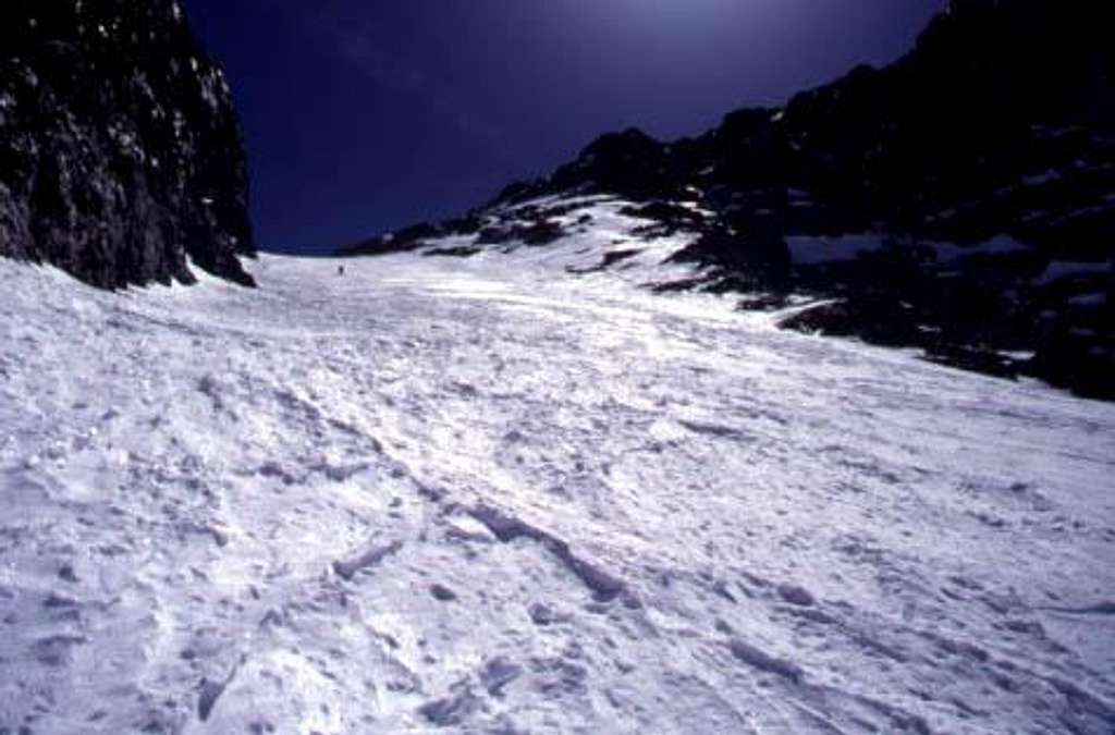A skier enters the top of the...