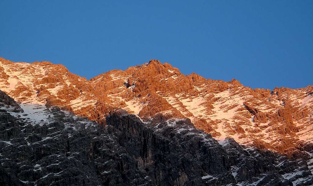 The Watzmann main summit seen from the west in alpine glow
