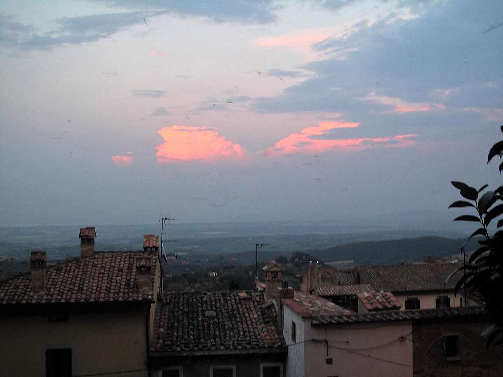 Thunderstorm clouds illuminated by the evening sun above Montepulciano