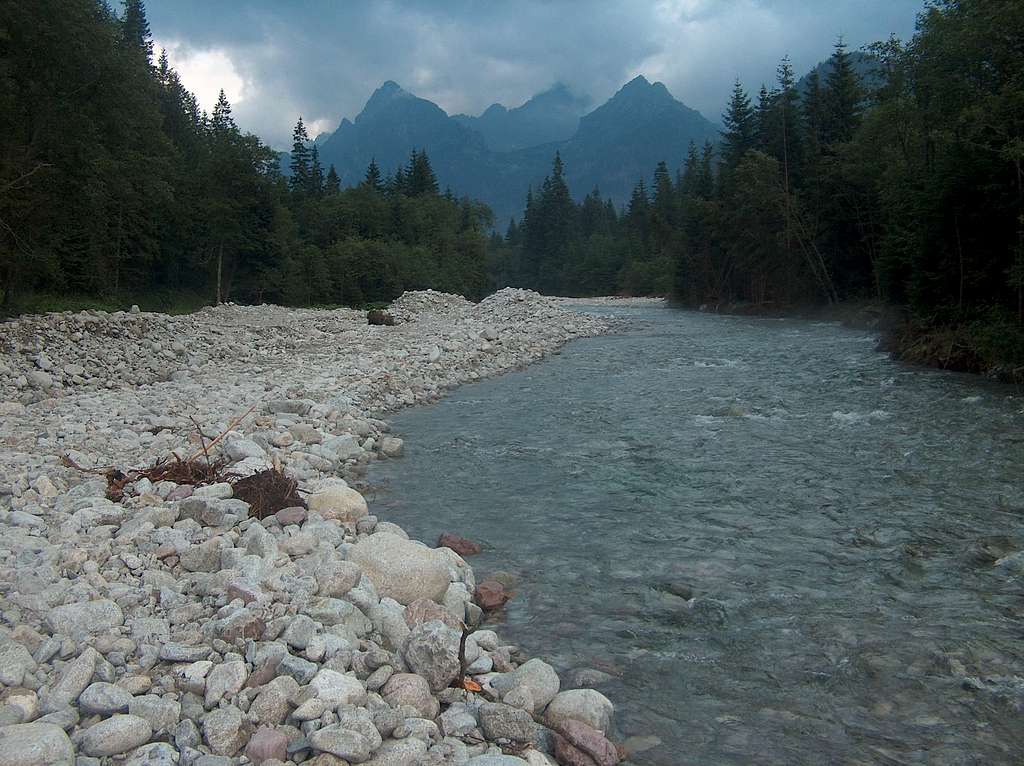 The capricous Bela Voda river carries masses of white granite peebles and boulders after every flooding