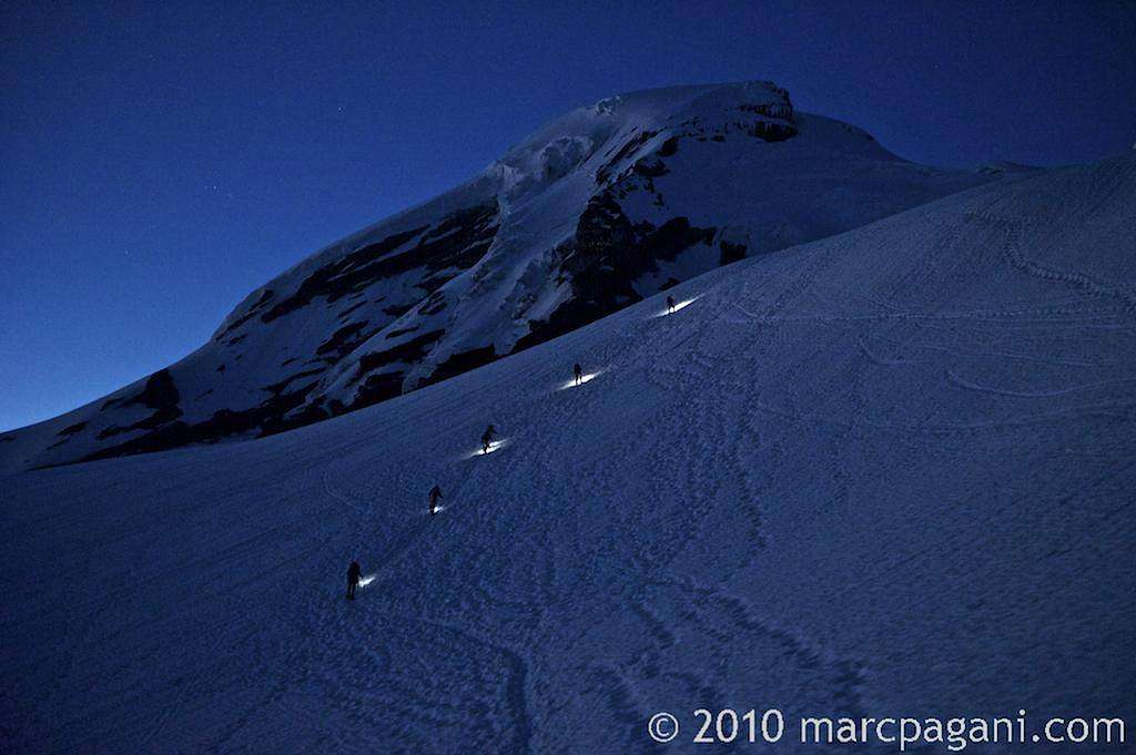 Climbers ascending just before sunrise on Mt Baker