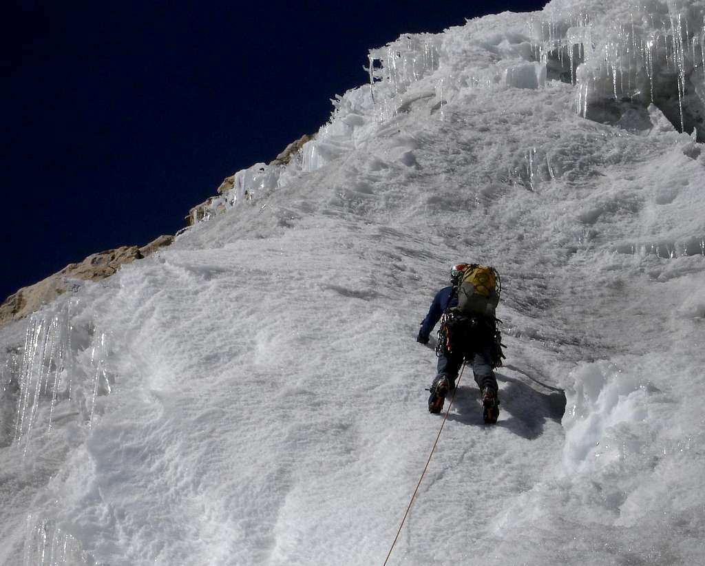 Telephoto shot of Alex half way up the 1st ice pitch.