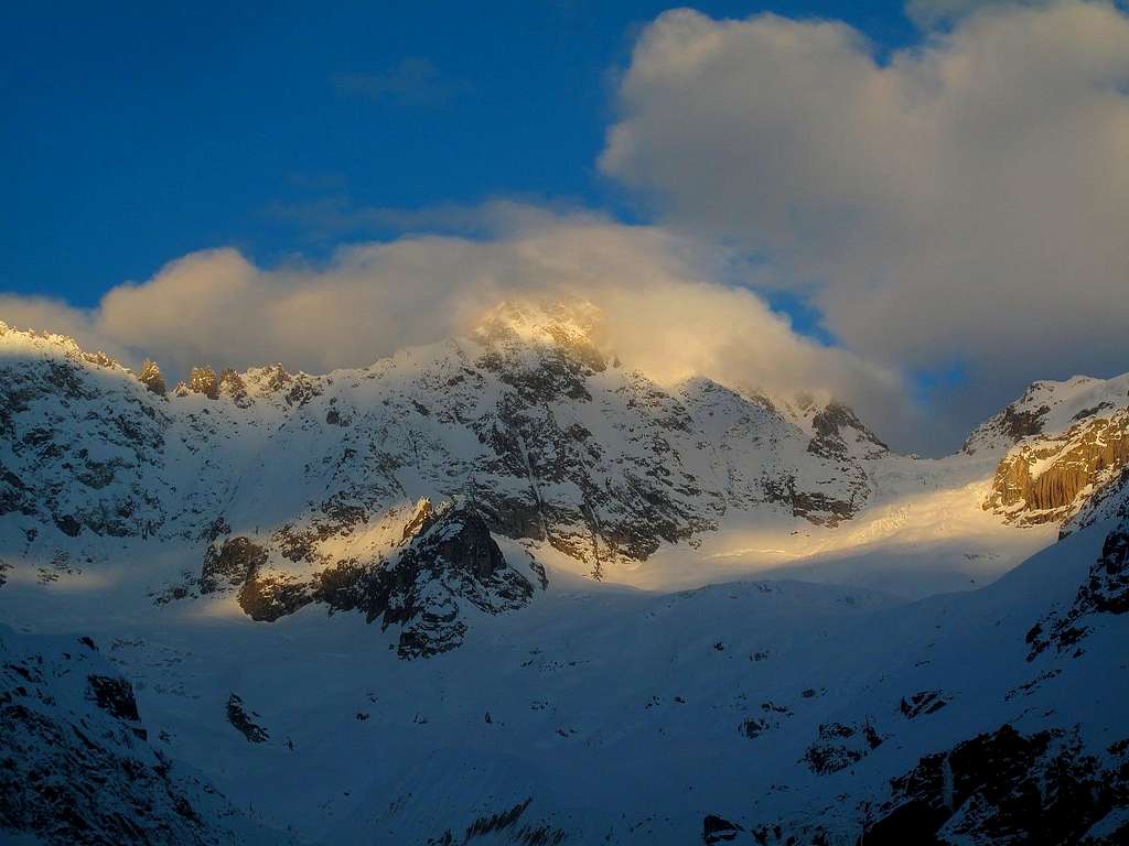 Le Tour Noir (3835m) emerging out of the clouds in the early morning light