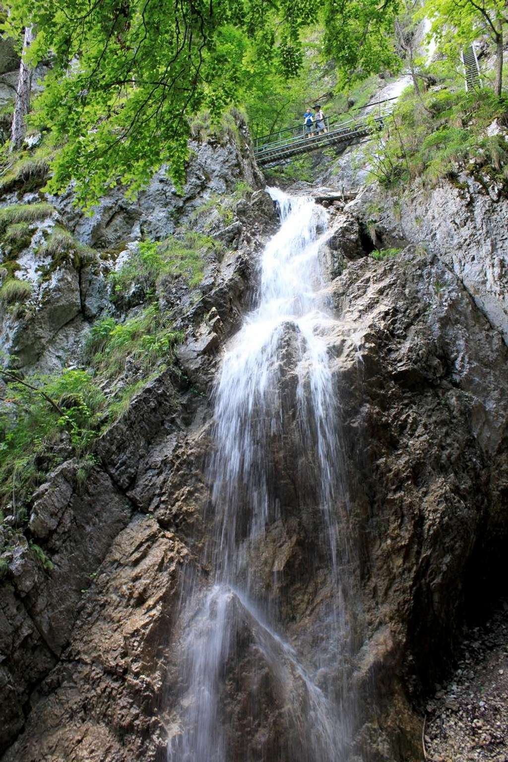 Bridge between waterfalls