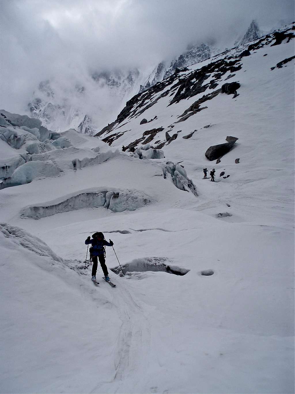 Cautious descent over weakening snowbridges on the Glacier d'Argentère
