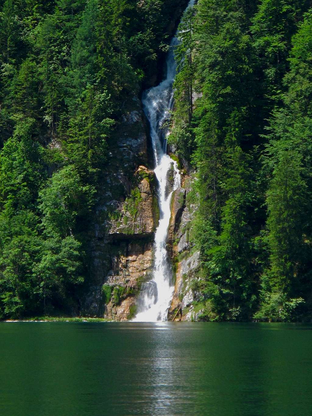 A waterfall flowing into the Königssee lake