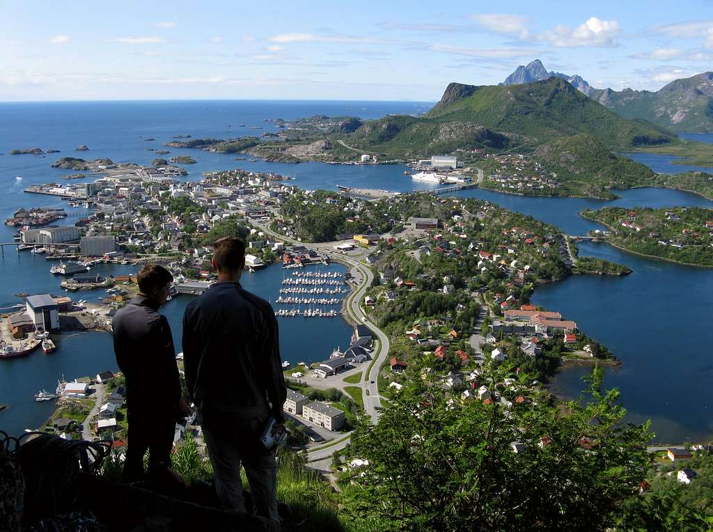 A party looking at the town before starting the climb, Svolvaer Geita
