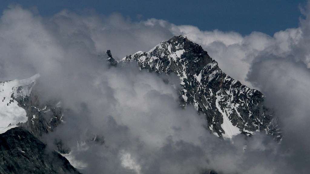 Weisshorn breaking through the clouds