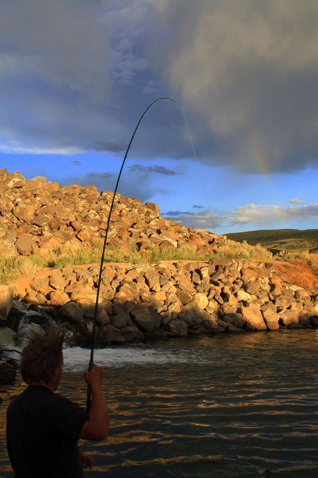 Catching a Rainbow Trout under a Rainbow
