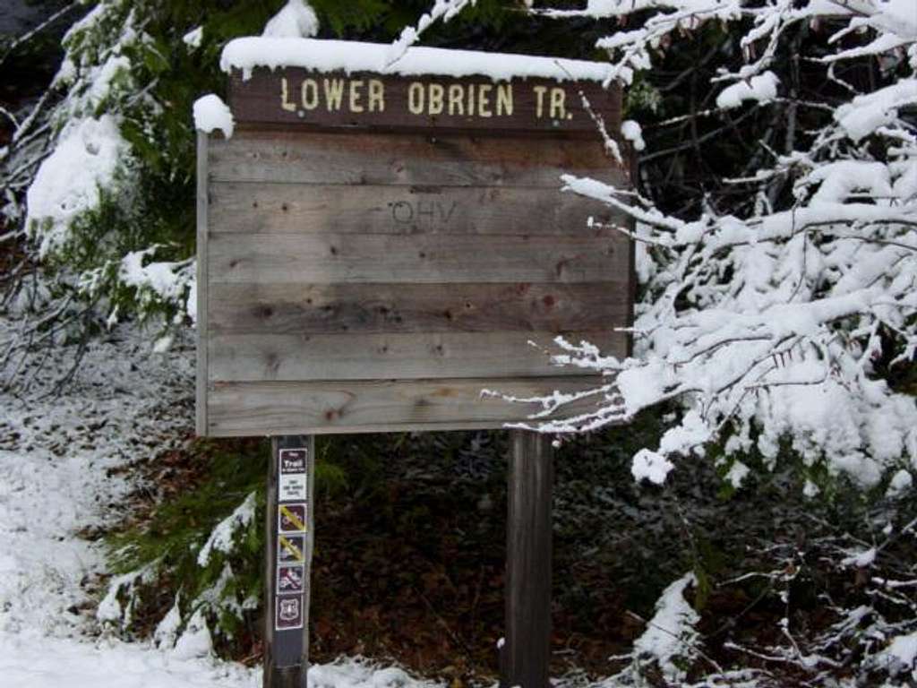 Lower trailhead sign. It's...