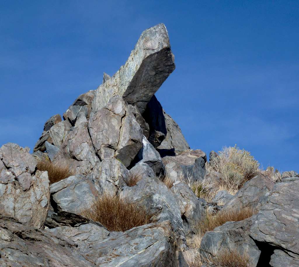 Finger-like rock below the summit