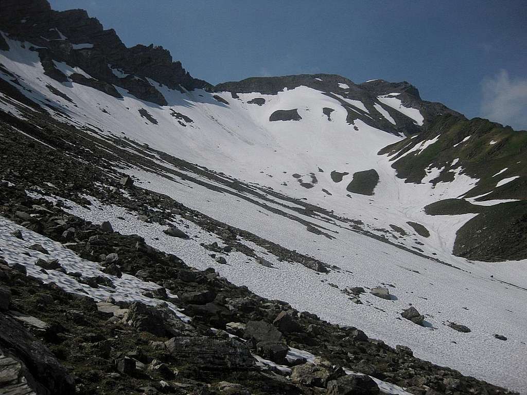 It's early summer, and a big snow field covers the northern slopes below Ijesfürggli