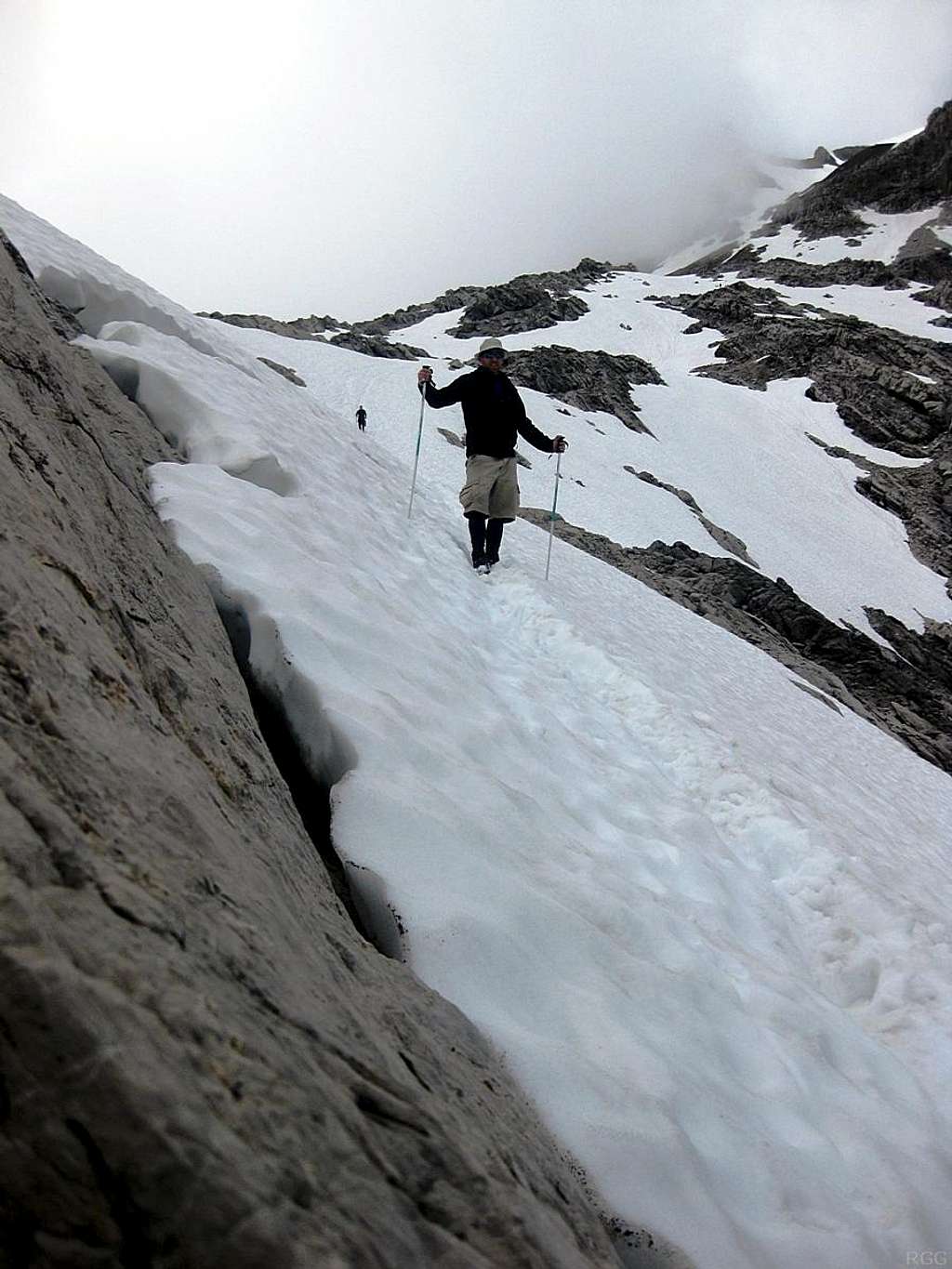 Descending a steep snow field on Schesaplana