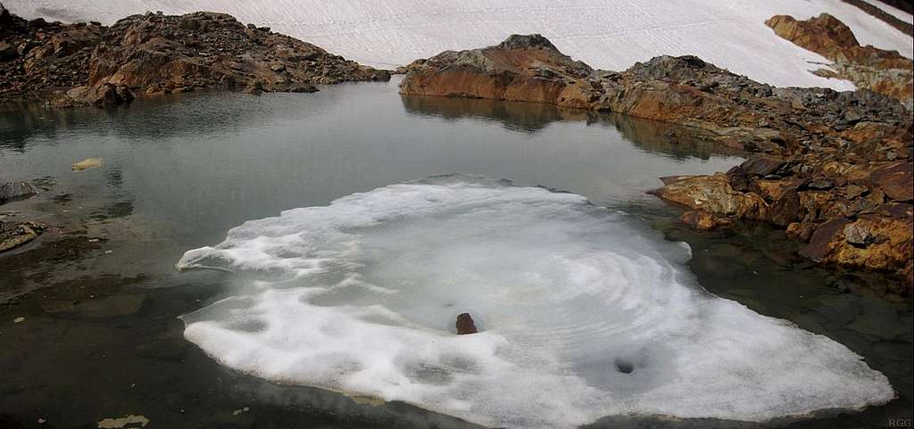 A pool of melt water on the slopes just below and east of the Rofenkarferner