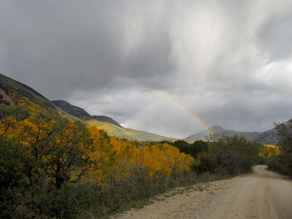 Rainbow driving into La Sal Pass