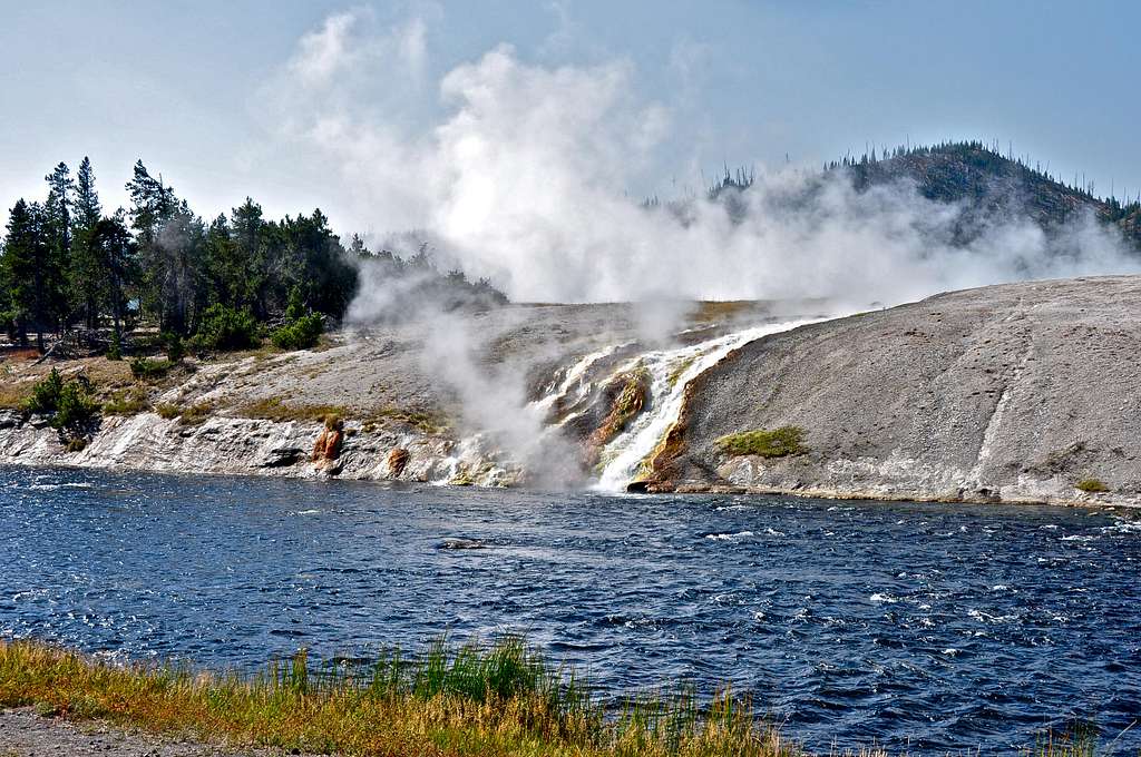 Hot volcanic stream pouring into Firehole River