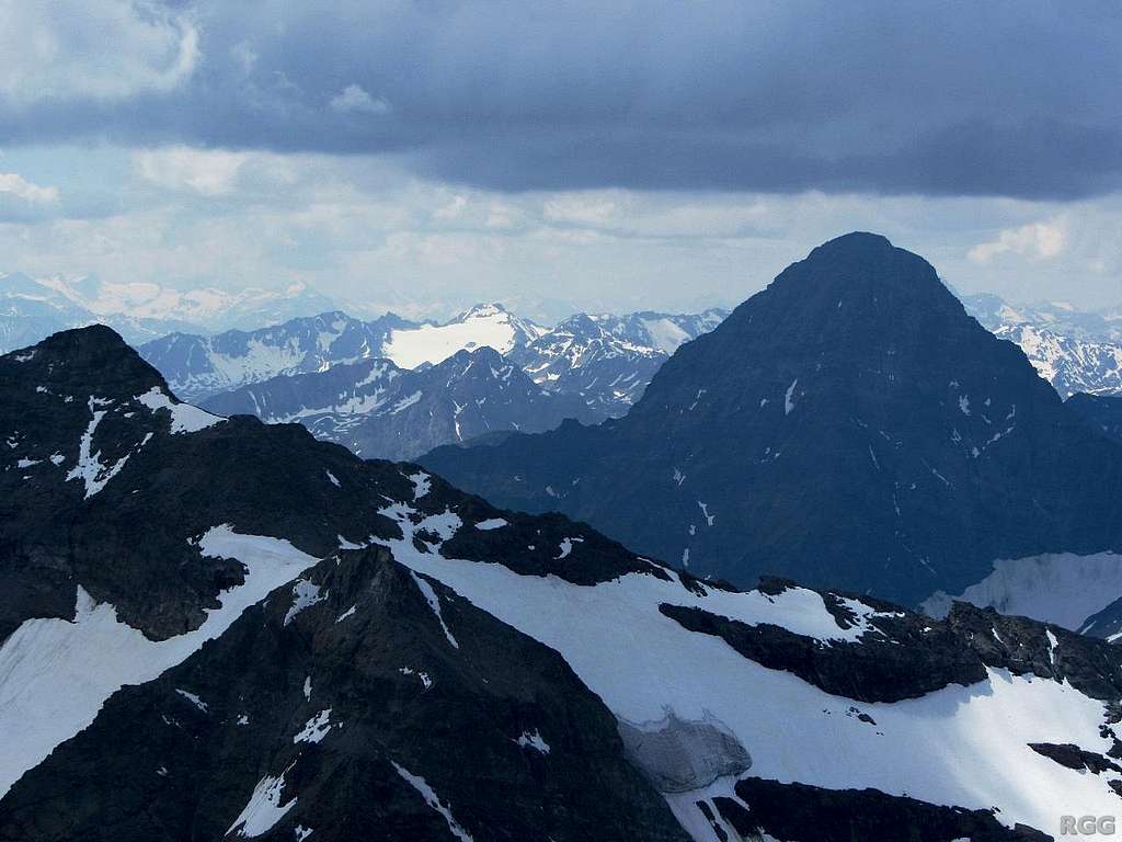 Dark clouds over Piz Linard (3411m), seen from the top of Piz Buin