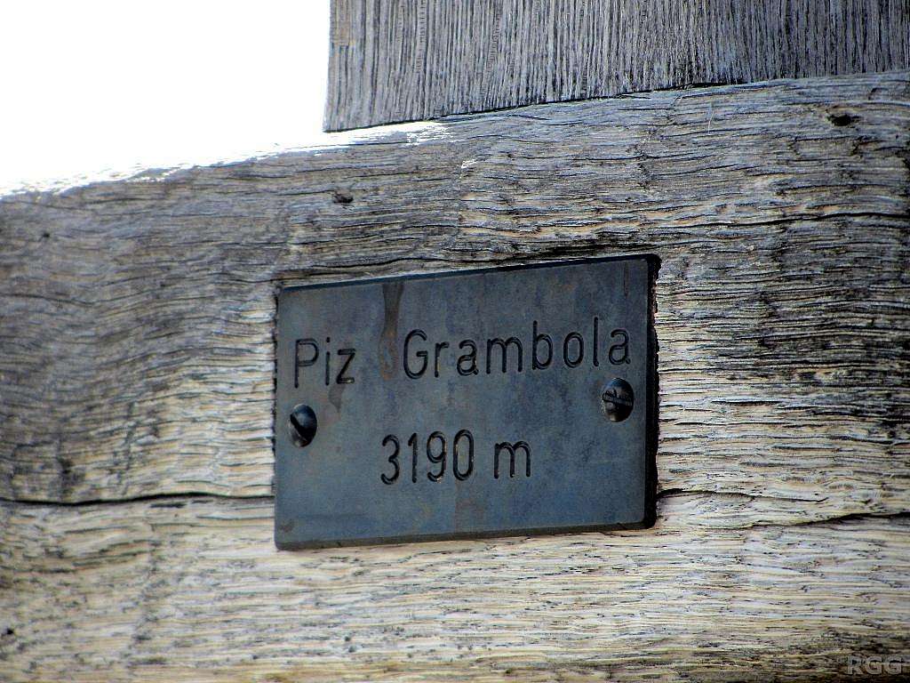 Close up of the plaque on the Piz Grambola summit cross