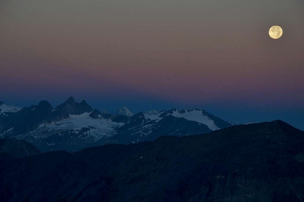 Full moon in the very early morning above the Pennine Alps