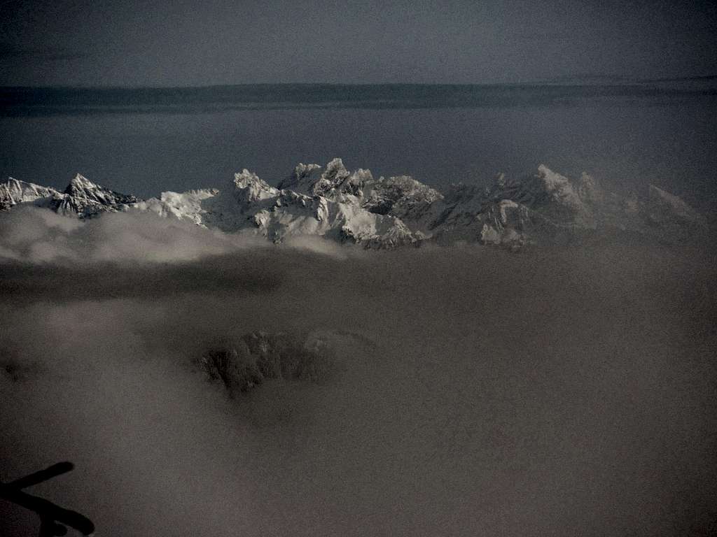 Mountains coming out through the clouds