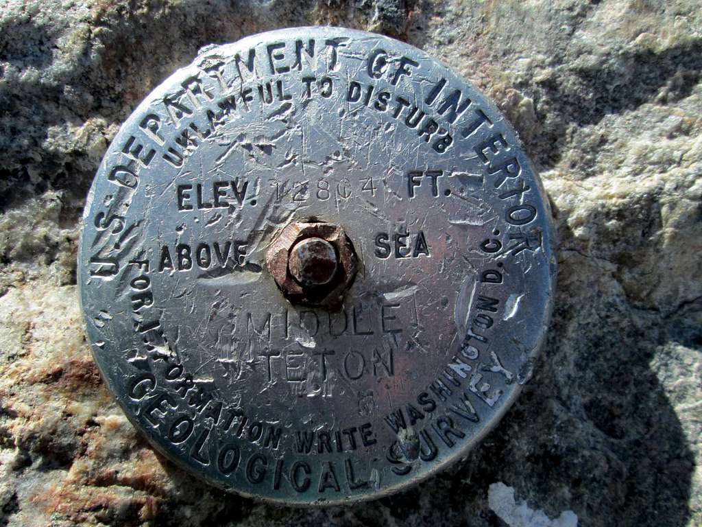 The summit marker at the top of the Middle Teton