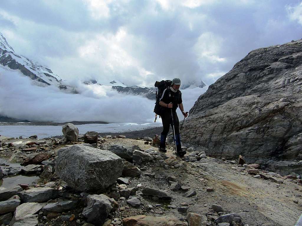 Mark against the backdrop of a bank of clouds rolling up the Gorner Glacier