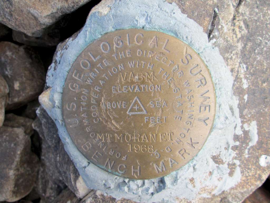 USGS summit marker on top of Mount Moran