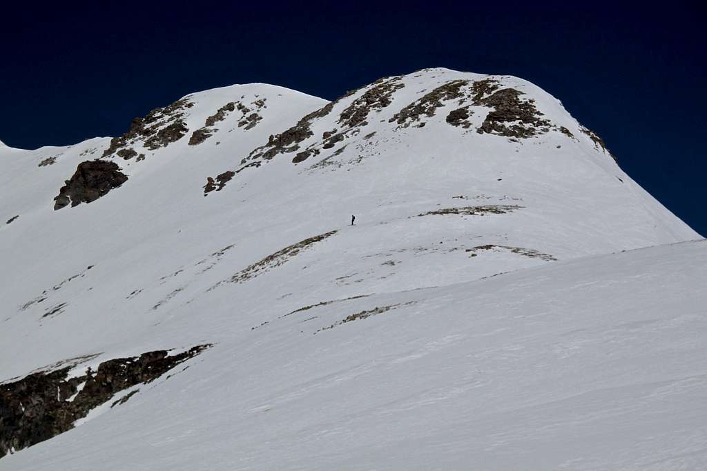 Skier below the summit of Trico Peak