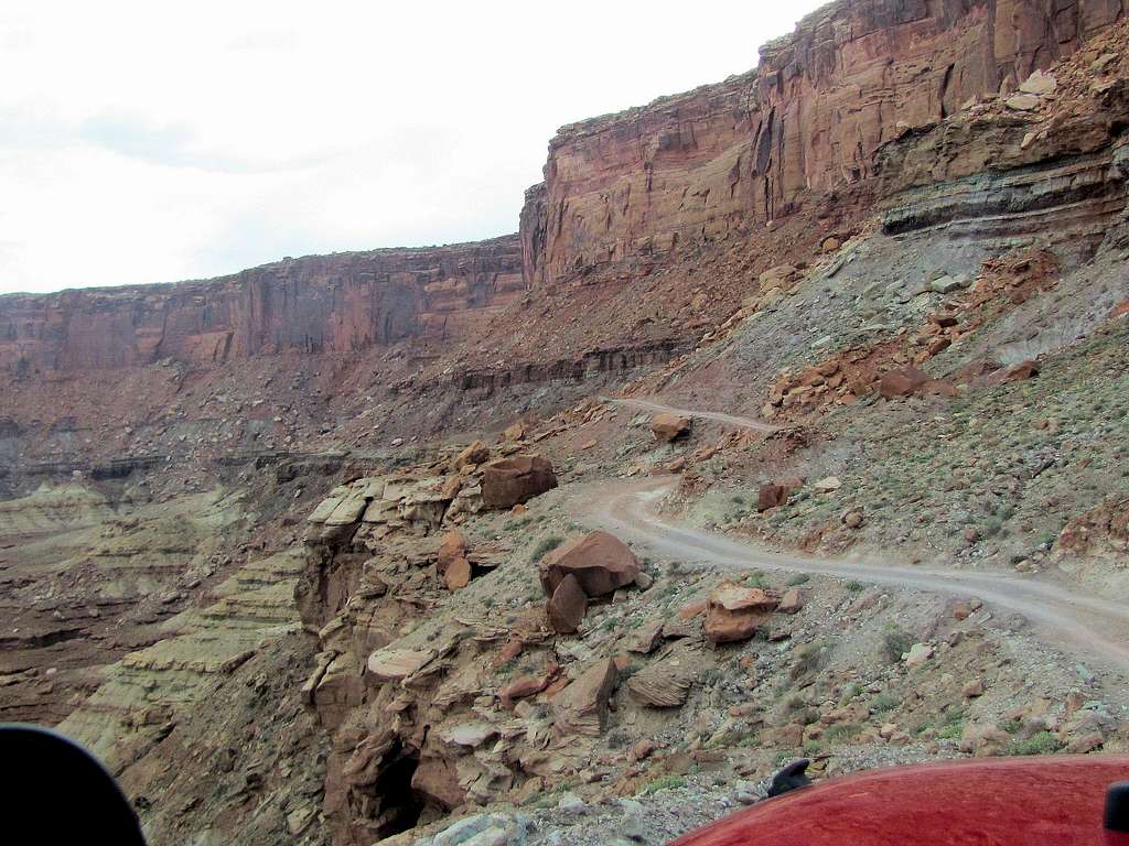 White Rim Road traversing a steep slope more than 400 ft above Green River