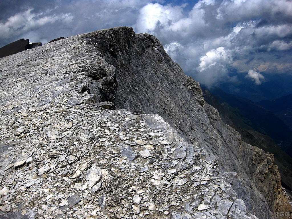 The flat summit ridge and steep east face of Schöllihorn