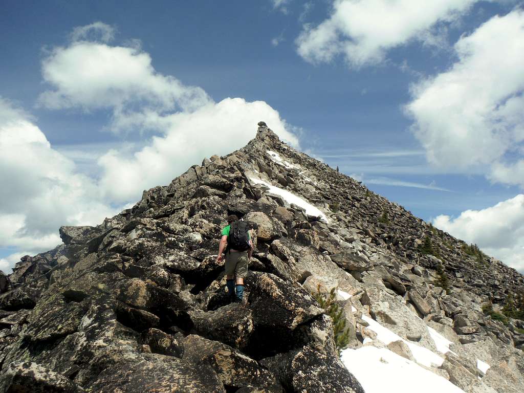 Josh scrambling up Hoodoo Peak