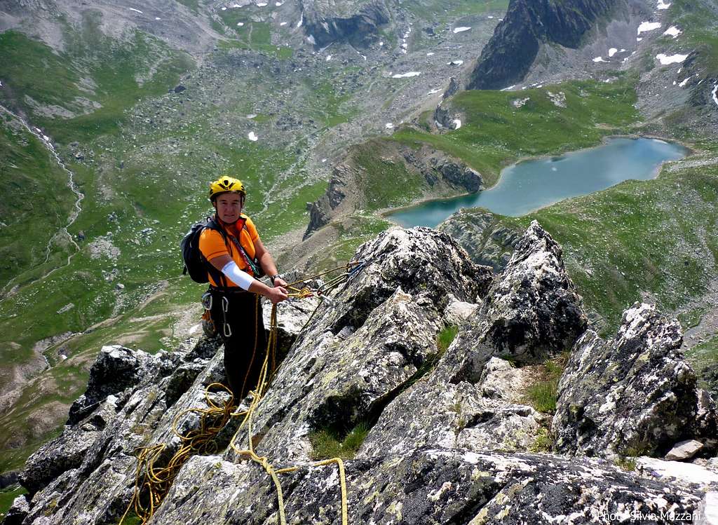 Belay on the summit crest and Marinet Lakes